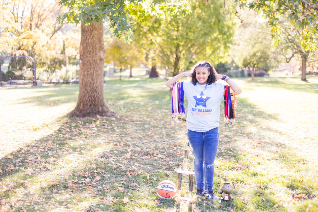 Female basketball player with medals